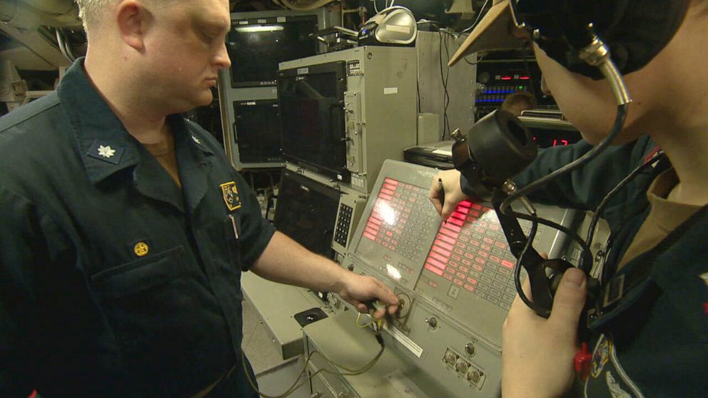 PHOTO: Cmdr. Darren Gerhardt at a launch console during a simulated launch exercise aboard the USS Maine.