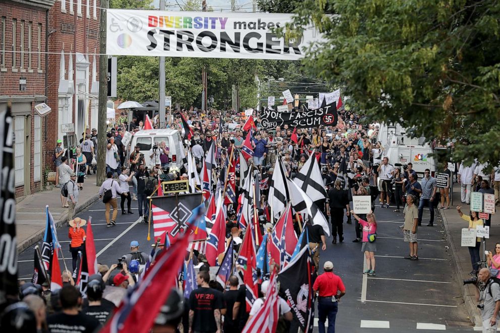 PHOTO: Hundreds of white nationalists, neo-Nazis and members of the alt-right march down East Market Street toward Emancipation Park during the Unite the Right rally August 12, 2017 in Charlottesville, Virginia.