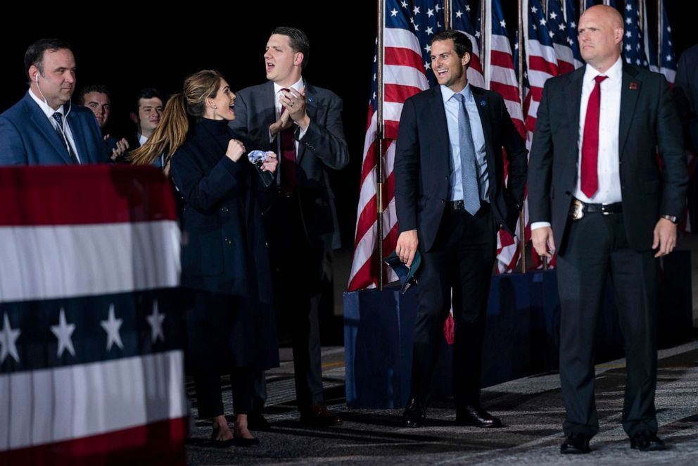 PHOTO: White House staffers Dan Scavino, Hope Hicks, William Russell, and John McEntee listen as President Donald Trump speaks during a campaign rally at Harrisburg International Airport, Sept. 26, 2020, in Middletown, Pa.