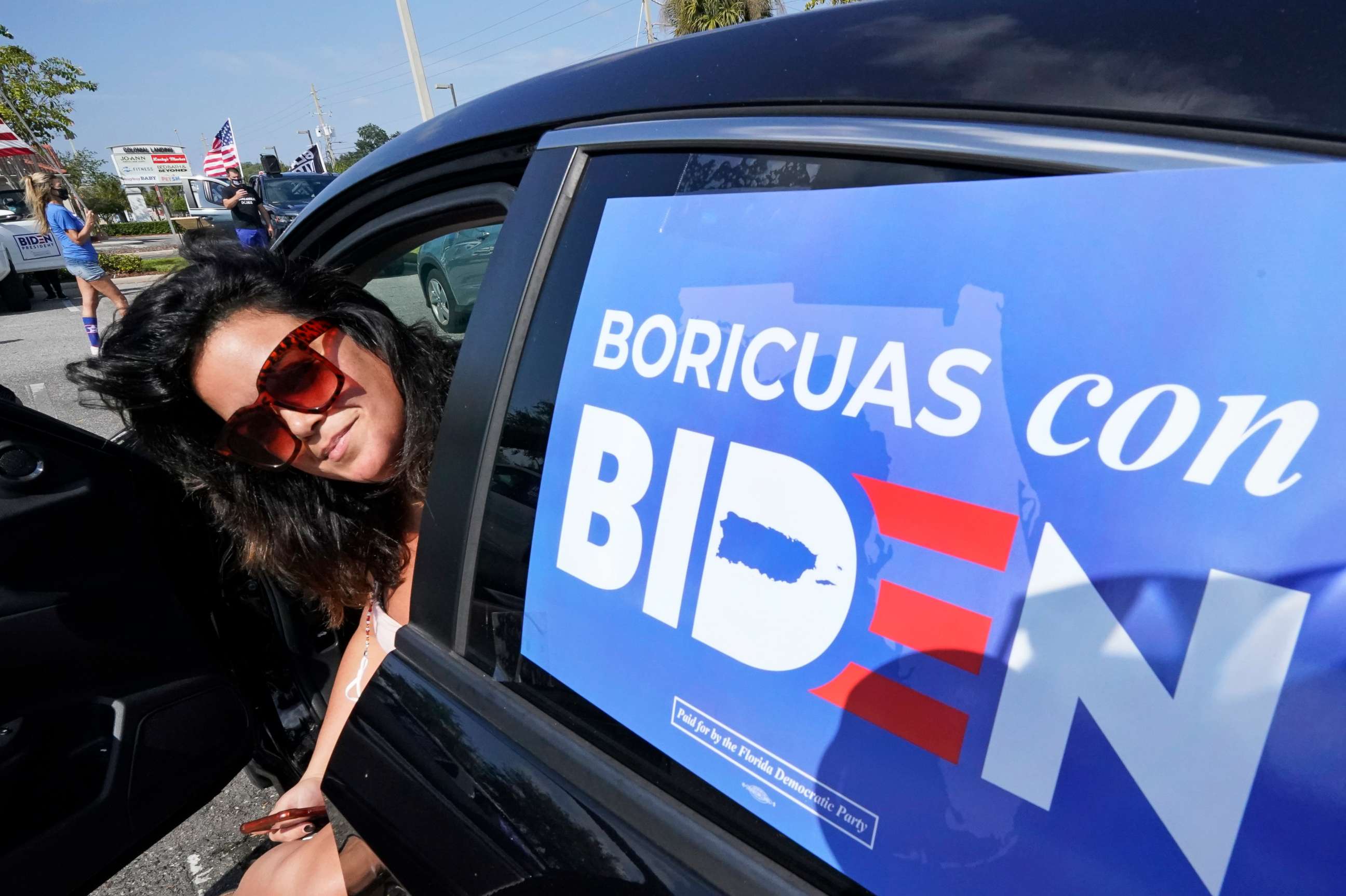PHOTO: Puerto Rican voter Ileana Manon attends a rally in support of Democratic presidential candidate and former Vice President Joe Biden, Oct. 17, 2020, in Orlando, Fla.