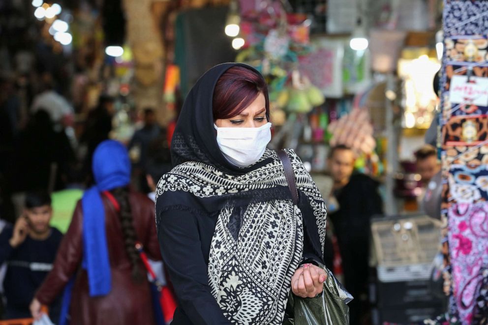 PHOTO: An Iranian woman walks at the Grand Bazaar market in the capital Tehran, April 20, 2020, as the threat of the COVID-19 pandemic lingers ahead of the Muslim holy month of Ramadan.