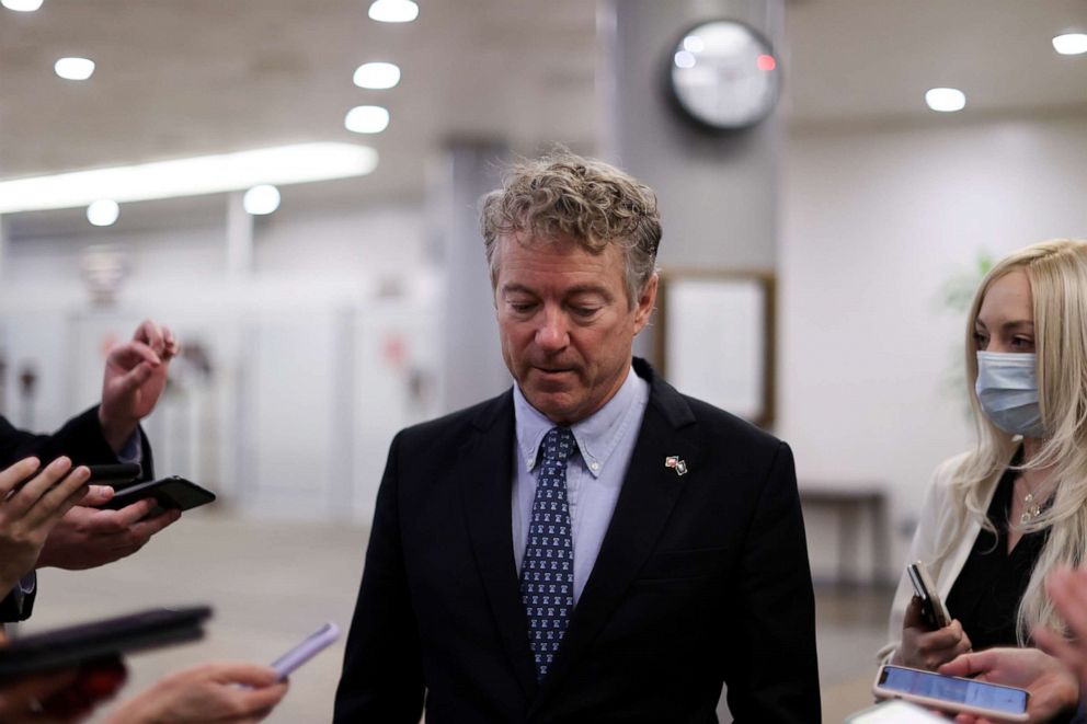 Sen. Rand Paul, R-Ky., is trailed by reporters as he arrives to be sworn in for the impeachment trial of former president Donald Trump in the U.S. Capitol in Washington on Jan. 26, 2021.