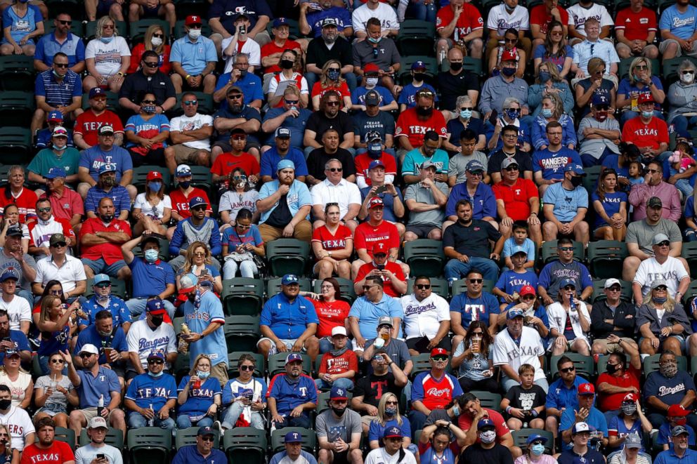 PHOTO: Fans watch the Texas Rangers take on the Toronto Blue Jays in the fourth inning on Opening Day at Globe Life Field, April 5, 2021 in Arlington, Texas.