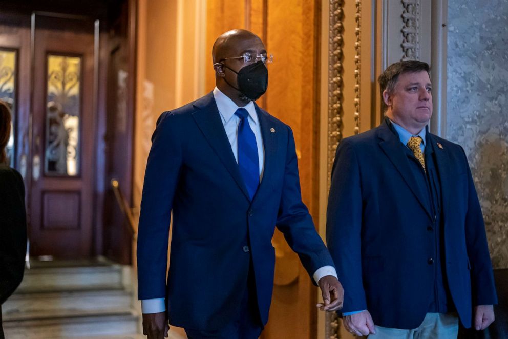 PHOTO: Sen. Raphael Warnock emerges from the Senate chamber during roll call votes leading to the confirmation of Supreme Court nominee Ketanji Brown Jackson as the first Black woman on the high court, at the Capitol in Washington, April 7, 2022.