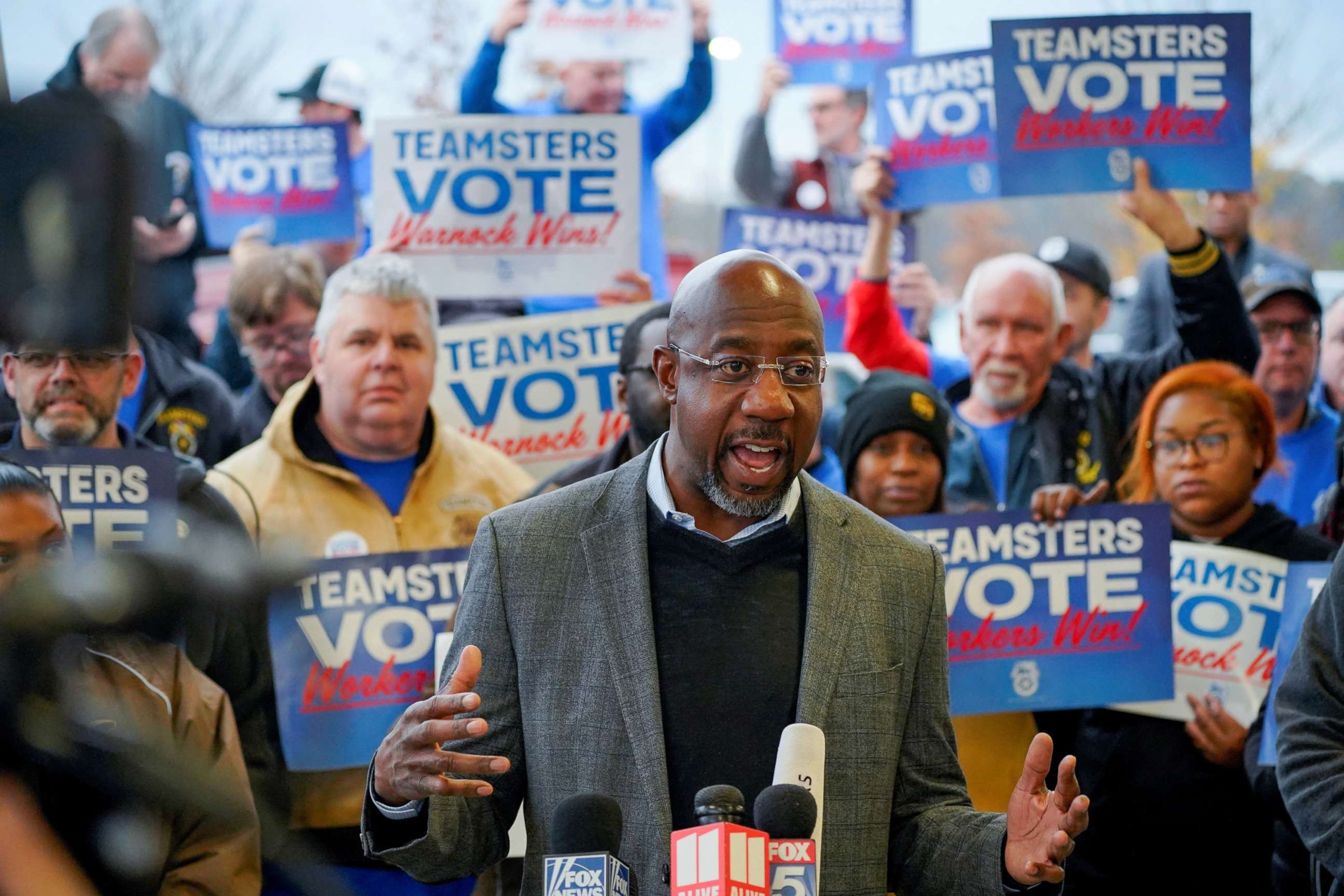 PHOTO: Reverend Raphael Warnock, Democratic Senator for Georgia, speaks during a "Get Out the Vote" midterm runoff election rally and Teamsters worksite visit at a UPS facility in Atlanta, Ga., Dec. 5, 2022. 