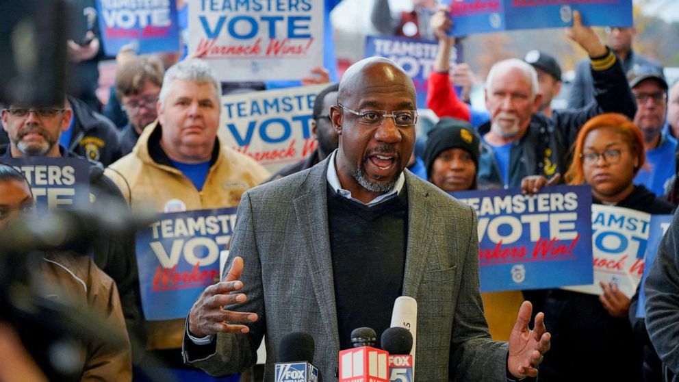 PHOTO: Reverend Raphael Warnock, Democratic Senator for Georgia, speaks during a "Get Out the Vote" midterm runoff election rally and Teamsters worksite visit at a UPS facility in Atlanta, Ga., Dec. 5, 2022. 