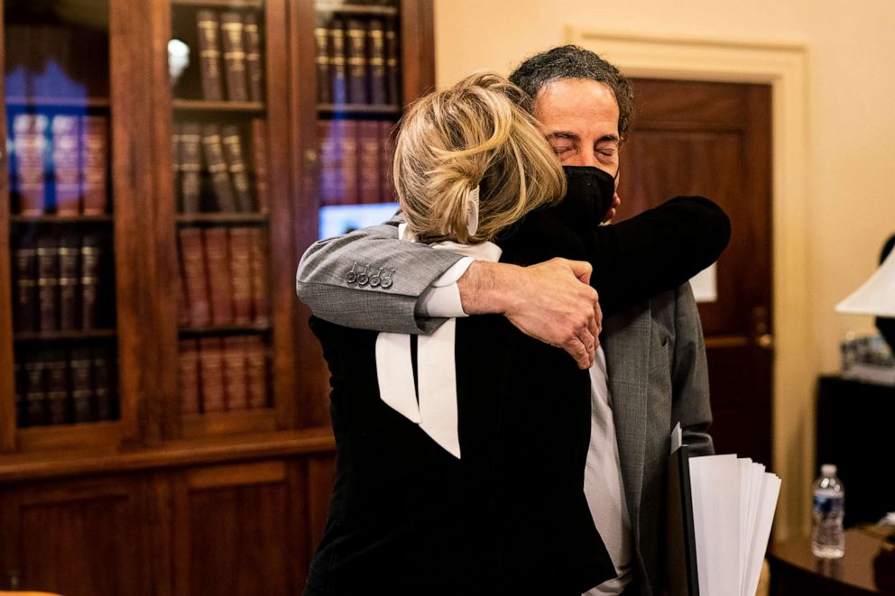 Lead House impeachment manager Jamie Raskin, right, hugs House impeachment manager Rep. Madeleine Dean after she spoke during the second day of the second impeachment trial for former President Donald Trump at the Capitol in Washington on Feb. 10, 2021.