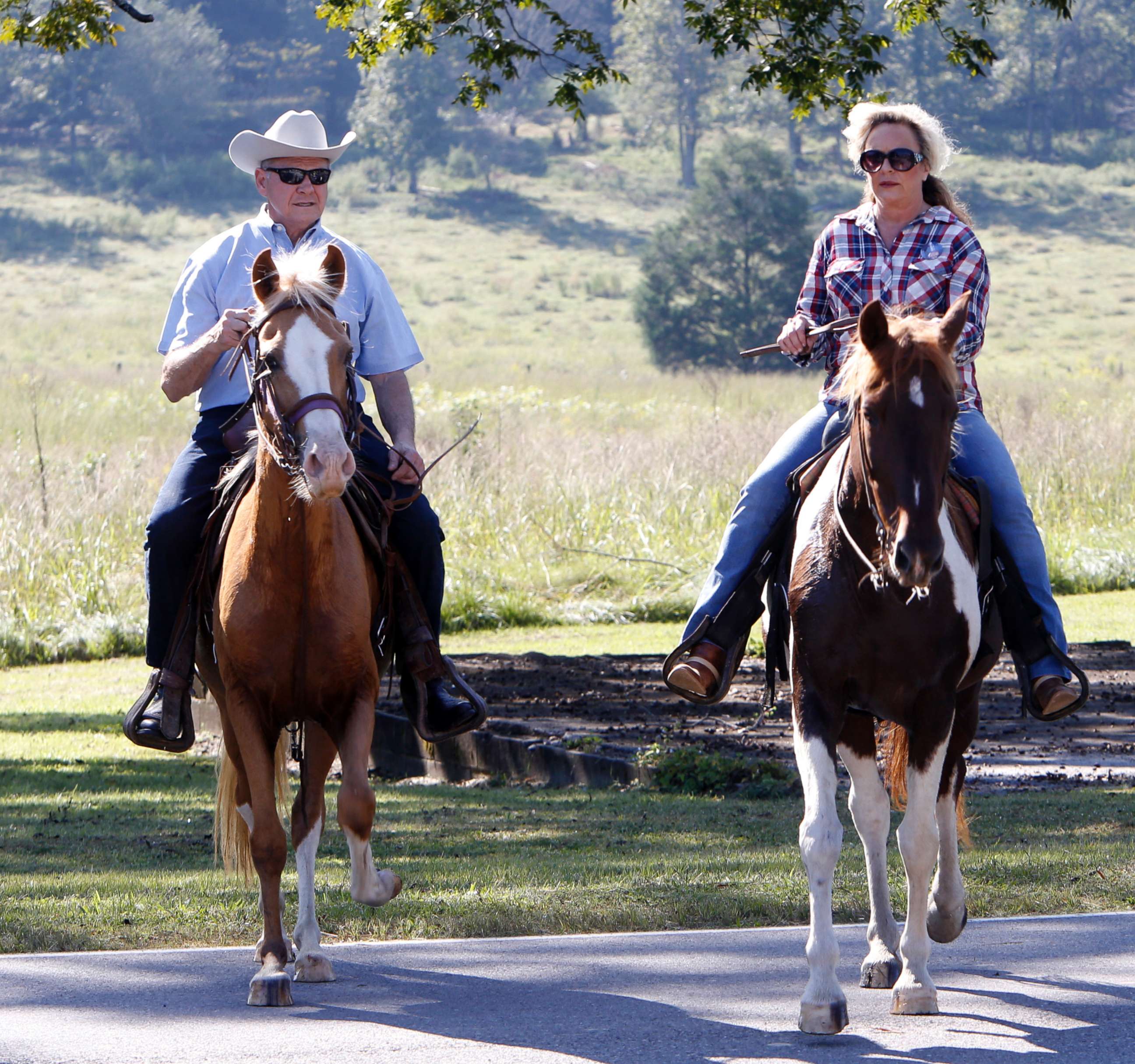 PHOTO: Alabama Republican Senate candidate Roy Moore on Sassy and wife Kayla on Sundance ride their horses to the Gallant Fire Hall to vote in today's GOP runoff election, Sept. 26, 2017, in Gallant, Ala.