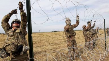 pulling barbed wire