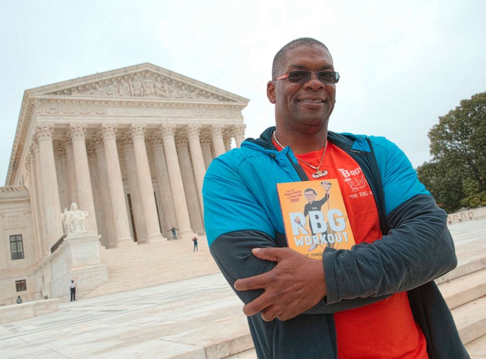 PHOTO: Bryant Johnson, personal trainer for Supreme Court Justice Ruth Bader Ginsburg poses in Washington, Oct. 13, 2017, with his book, "The RBG Workout: How She Stays Strong ... and You Can Too!"