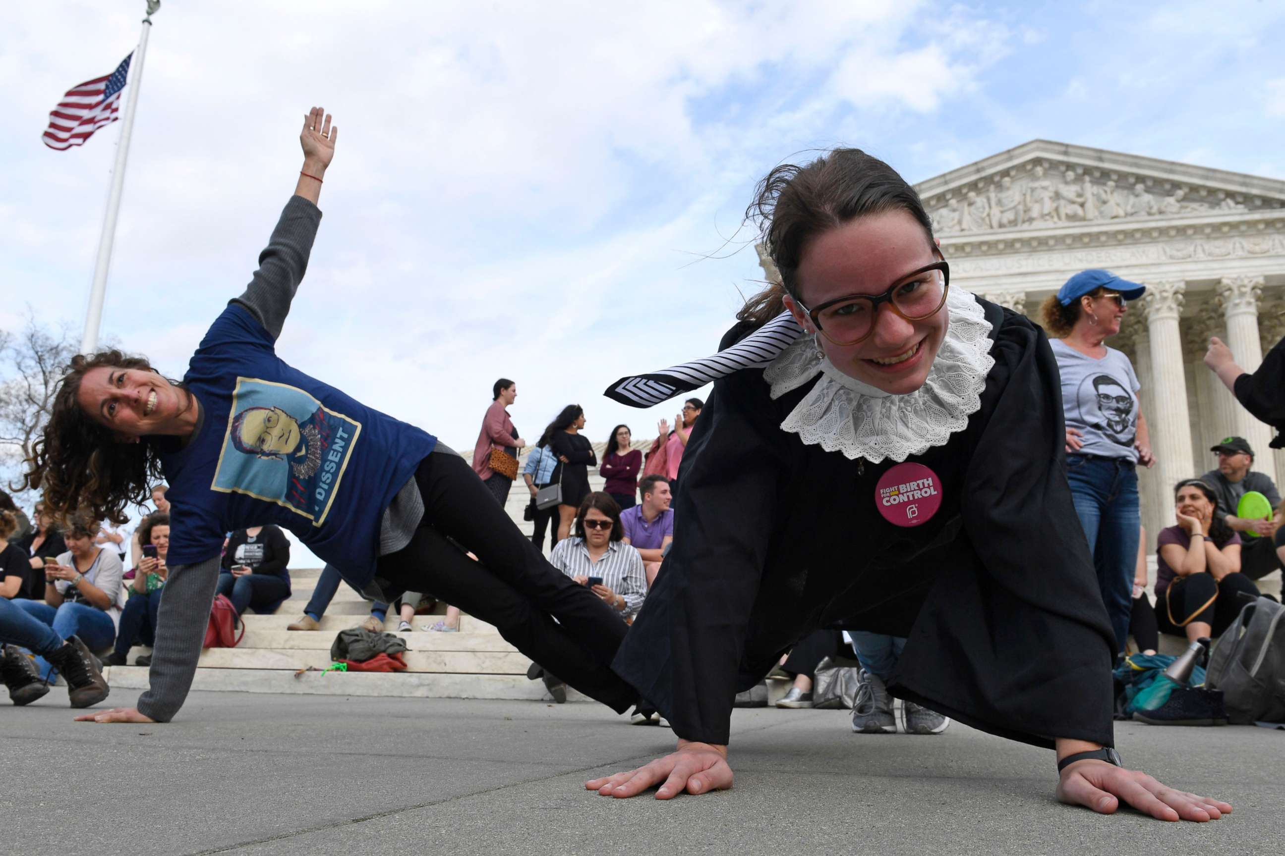 PHOTO: Stephanie Firestone, left, and Alice Wisbiski both fans of Supreme Court Associate Justice Ruth Bader Ginsburg, do exercises on the steps of the Supreme Court in Washington, March 15, 2019, to celebrate Ginsburg's upcoming birthday 86th birthday.