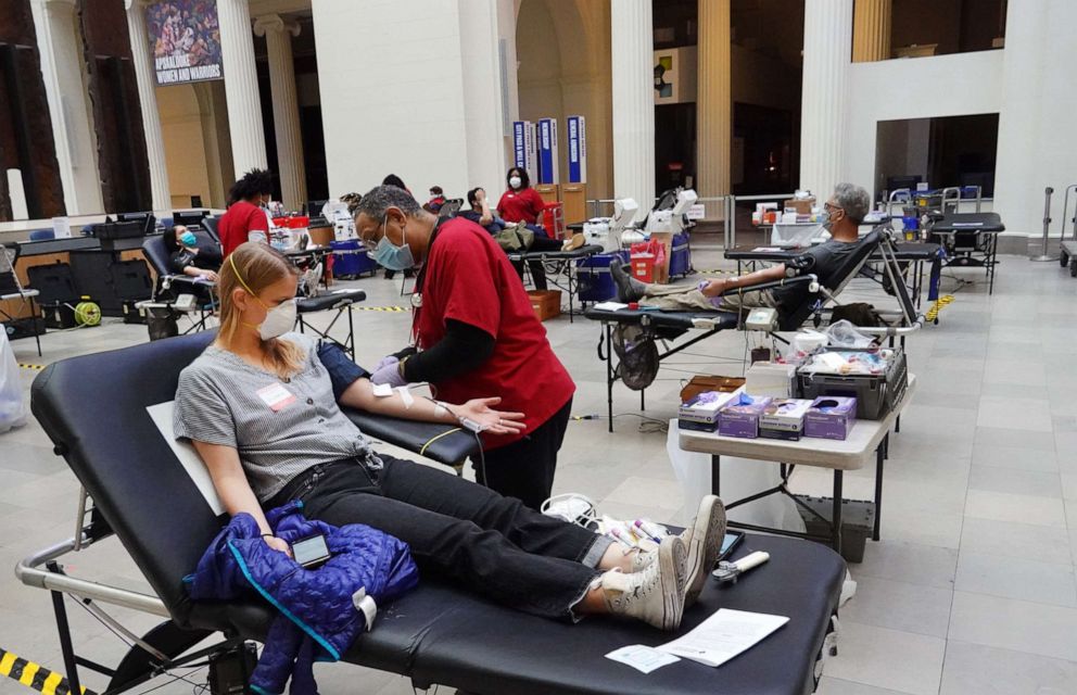 PHOTO: Phlebotomist Herbert Collins draws blood from Victoria Reese during an American Red Cross blood drive held at the Field Museum of Natural History on May 11, 2020 in Chicago.