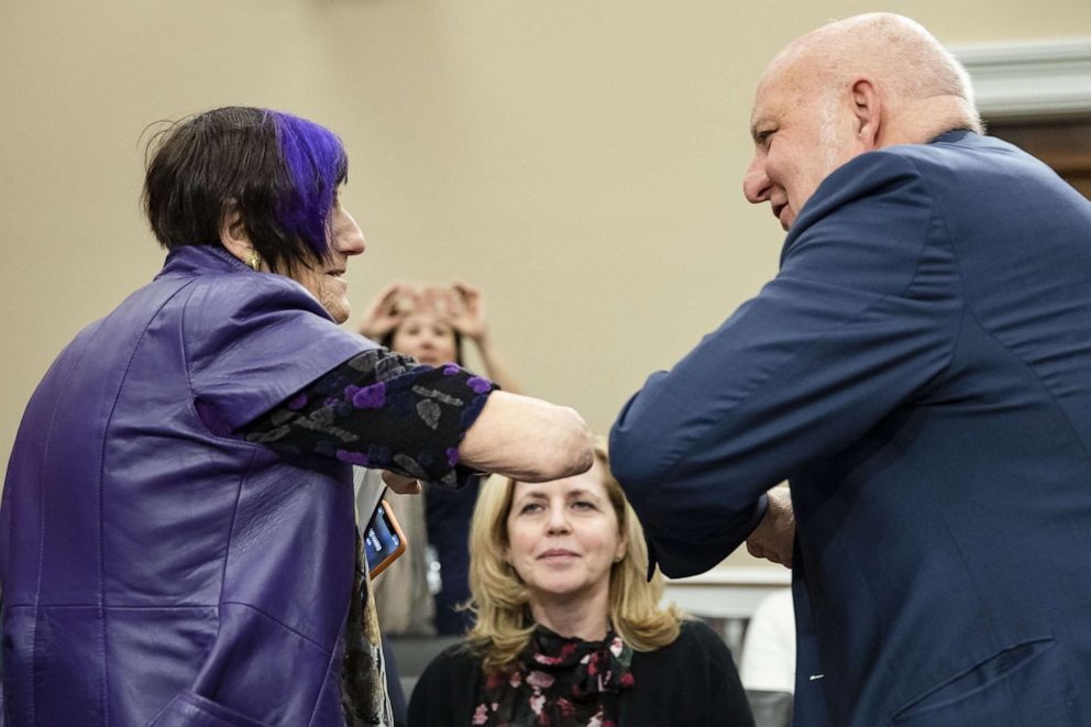 PHOTO: Rep. Rosa DeLauro and CDC Director Robert Redfield bump elbows prior to Redfield testifying before the House Appropriations Committee on the CDC's budget request for fiscal year 2021 on Capitol Hill on March 10, 2020, in Washington.