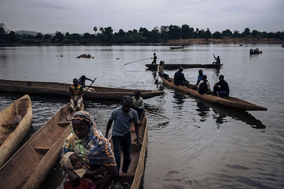 Central African refugees arrive in Ndu after crossing the Mbomou River, which marks the border between the Central African Republic and the Democratic Republic of Congo, on Feb. 5, 2021. 