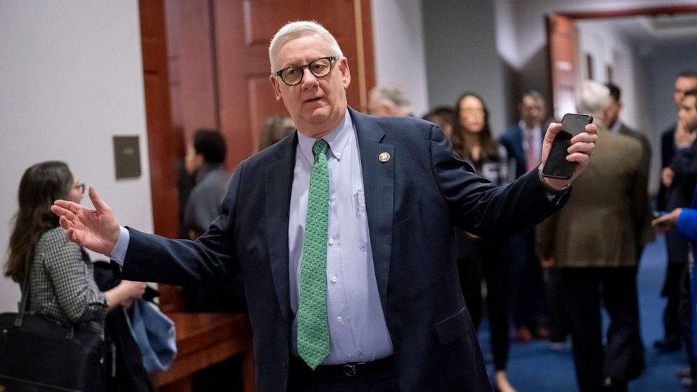 PHOTO: Rep. Paul Mitchell leaves an overcrowded room at the Capitol where members of the House of Representatives were getting a briefing with the coronavirus task force about the outbreak of the new respiratory virus, in Washington, DC., Feb. 28, 2020.