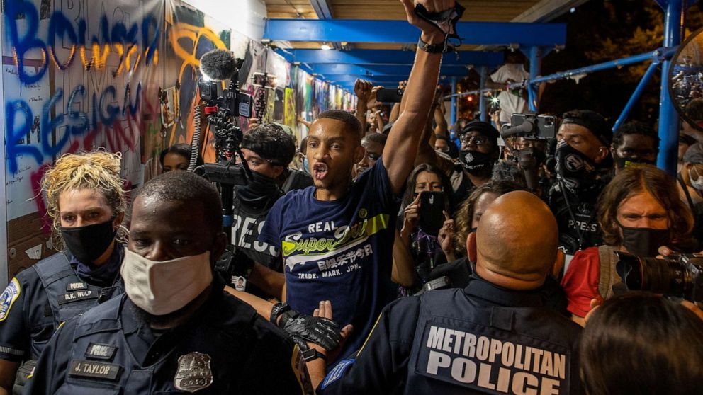 PHOTO: Washington D.C. Police try to keep demonstrators back as they gather at Black Lives Matter plaza on Aug. 27, 2020, in Washington, during the final night of the Republican National Convention.