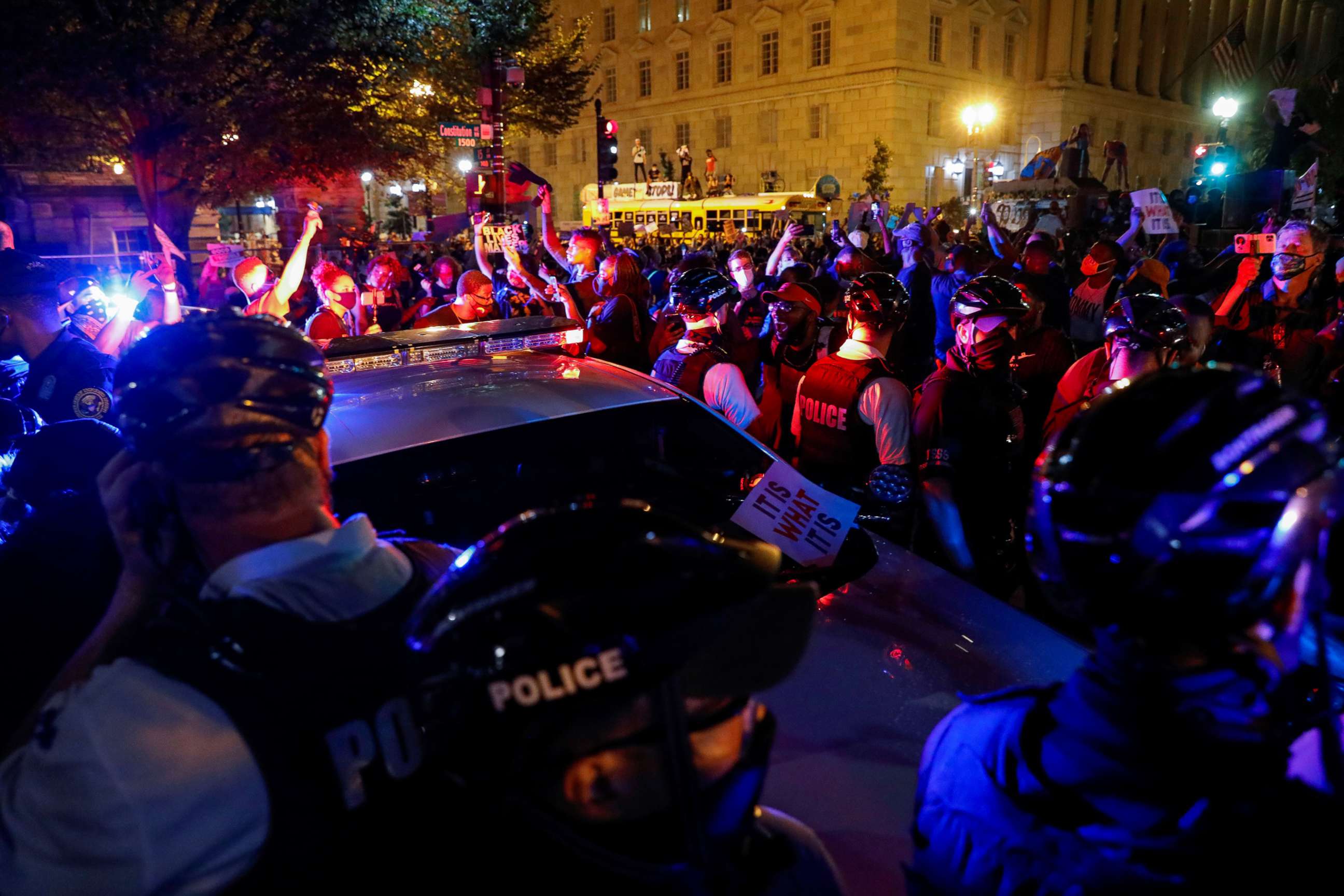 PHOTO: Demonstrators face off with police officers during a protest as police block their path on Constitution Avenue in Washington, Aug. 27, 2020.