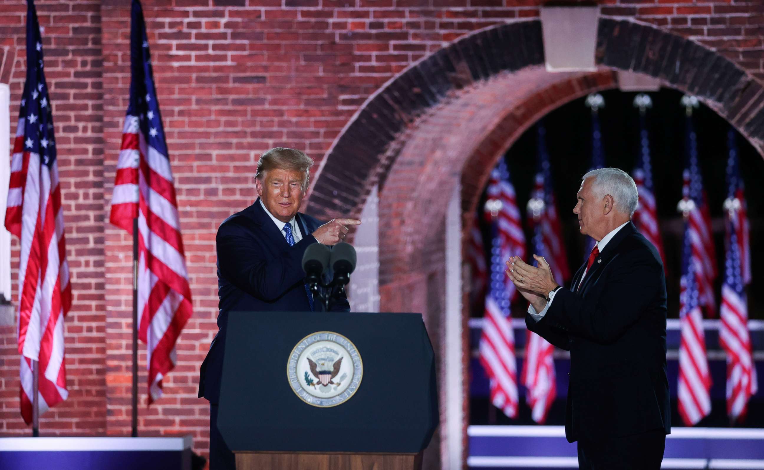 PHOTO: Vice President Mike Pence is joined onstage by President Donald Trump after delivering his acceptance speech during an event of the 2020 Republican National Convention held at Fort McHenry in Baltimore, Aug. 26, 2020. REUTERS/Jonathan Ernst