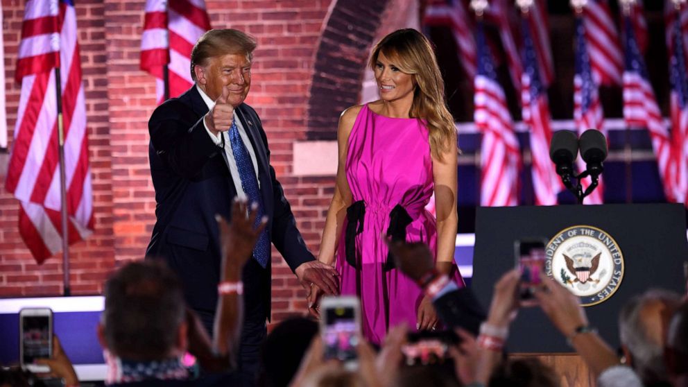 PHOTO: First lady Melania Trump and President Donald Trump greet to attendees during the third night of the Republican National Convention at Fort McHenry National Monument in Baltimore, Aug. 26, 2020.