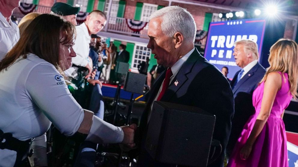 PHOTO: Vice President Mike Pence shakes hands after speaking on the third day of the Republican National Convention at Fort McHenry National Monument and Historic Shrine in Baltimore, Aug. 26, 2020.