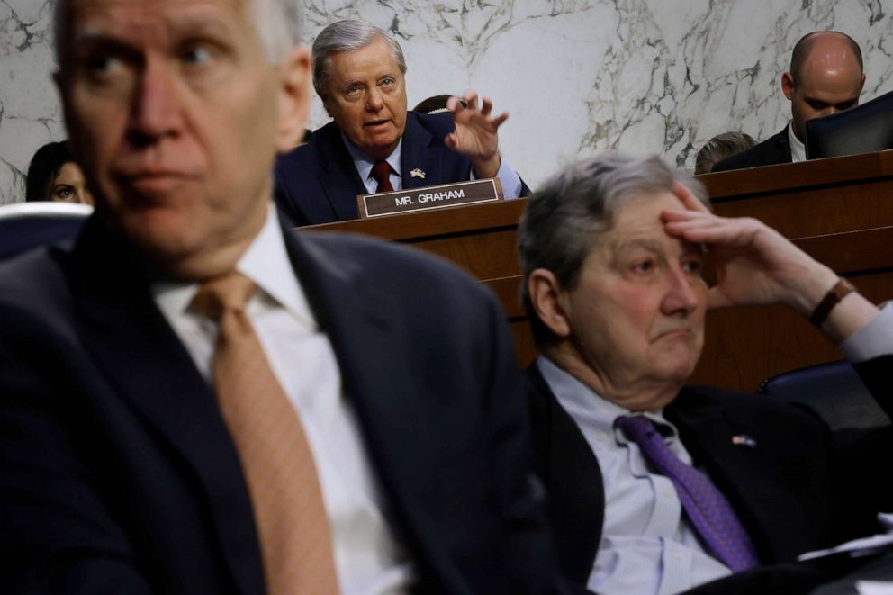 Framed by Republican Senators Thom Tillis and John Kennedy,Senate Judiciary Committee member Sen. Lindsey Graham questions Supreme Court nominee Judge Ketanji Brown Jackson during her confirmation hearing on Capitol Hill,March 23, 2022 in Washington.