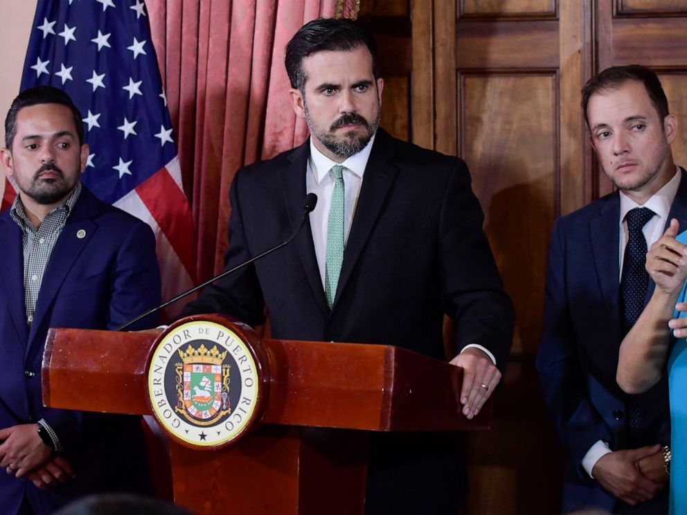 PHOTO: In this July 16, 2019 file photo, Puerto Rico Gov. Ricardo Rossello, accompanied by his chief of staff Ricardo Llerandi, right, attends a press conference in La Fortalezas Tea Room, in San Juan, Puerto Rico.