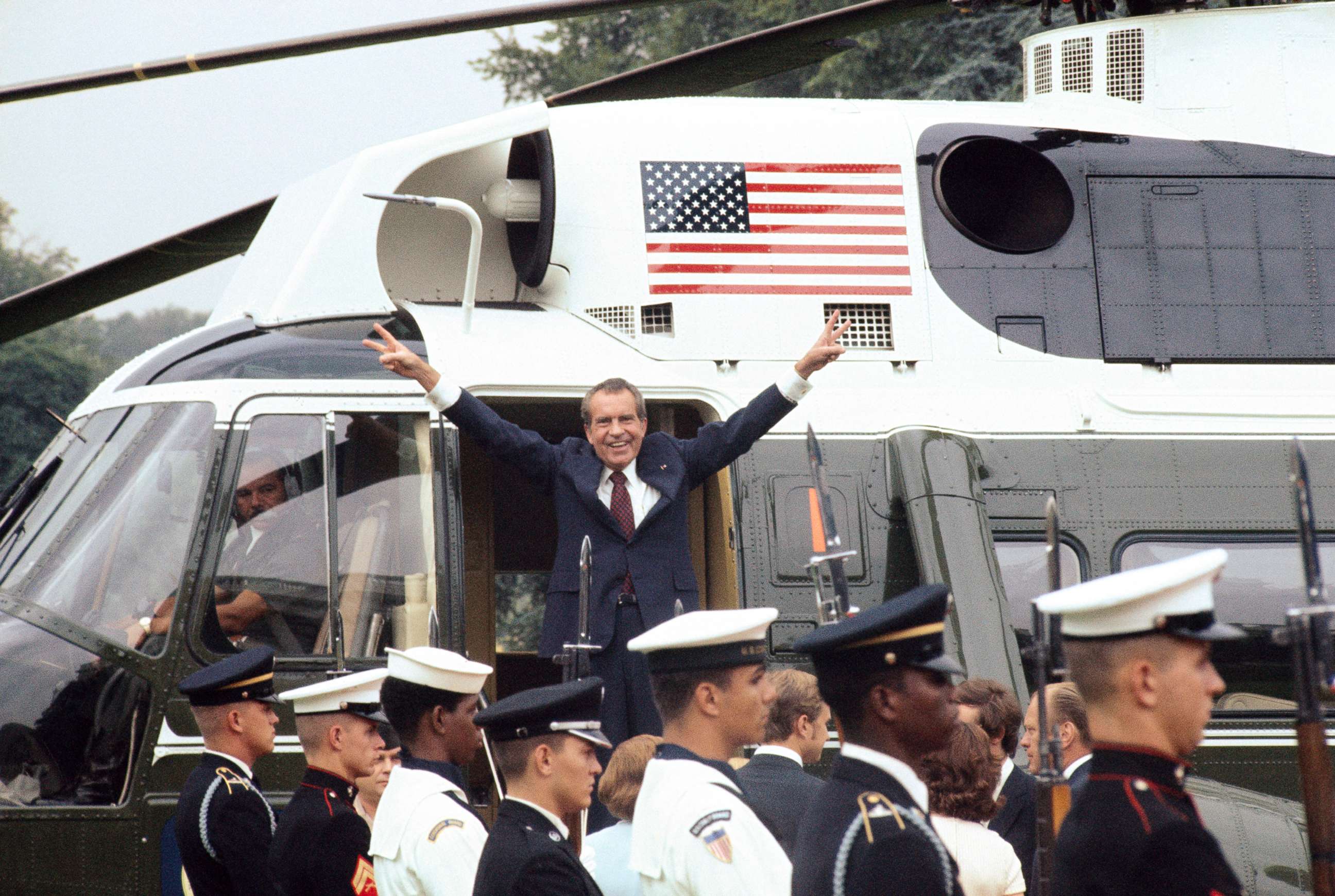 PHOTO: Richard Nixon smiles and gives the victory sign as he boards the White House helicopter after resigning the presidency, Aug. 9, 1974.