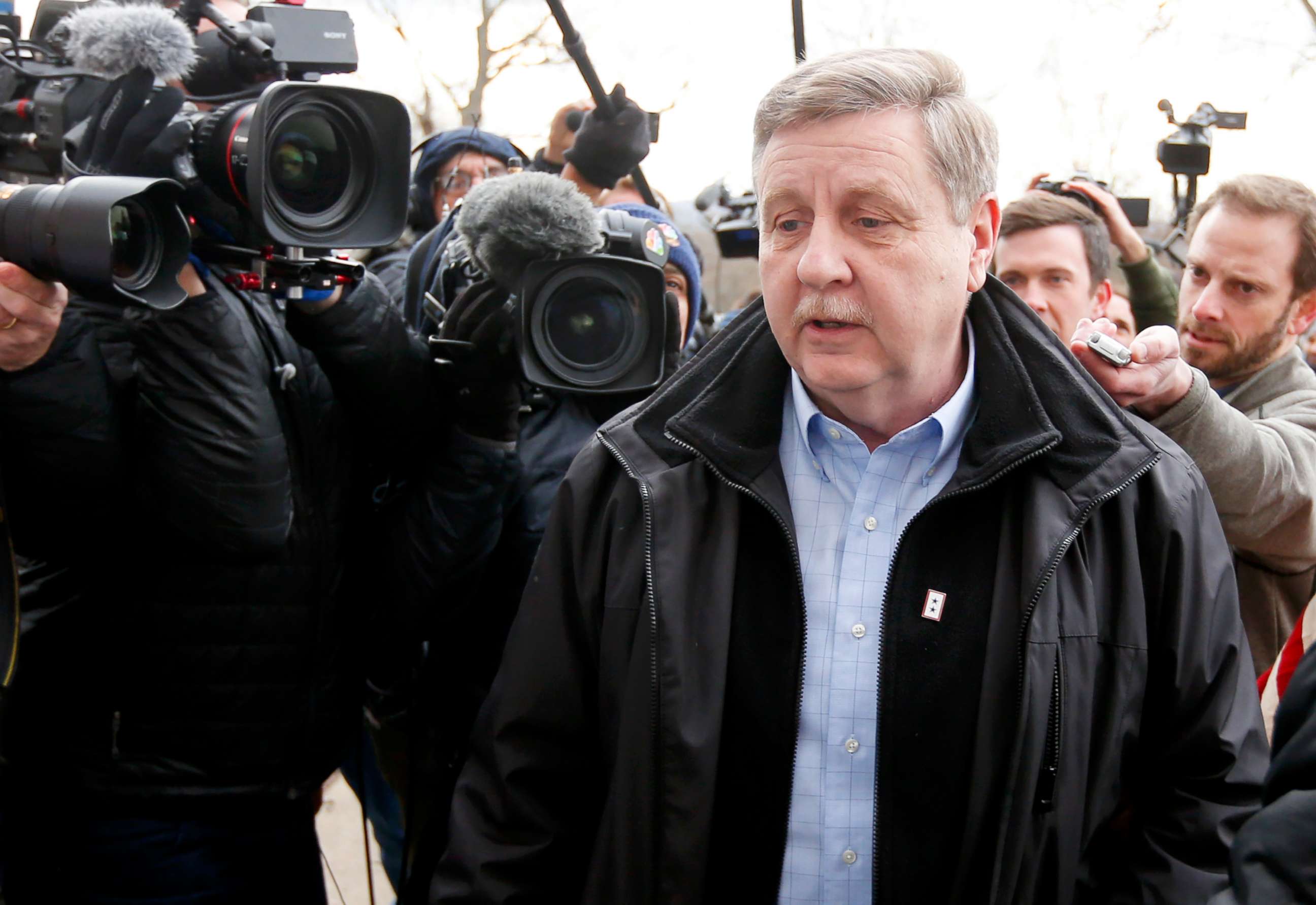 PHOTO: Republican Rick Saccone, center, makes his way through reporters as he heads to the polling place to cast his ballot on March 13, 2018 in McKeesport, Pa. 