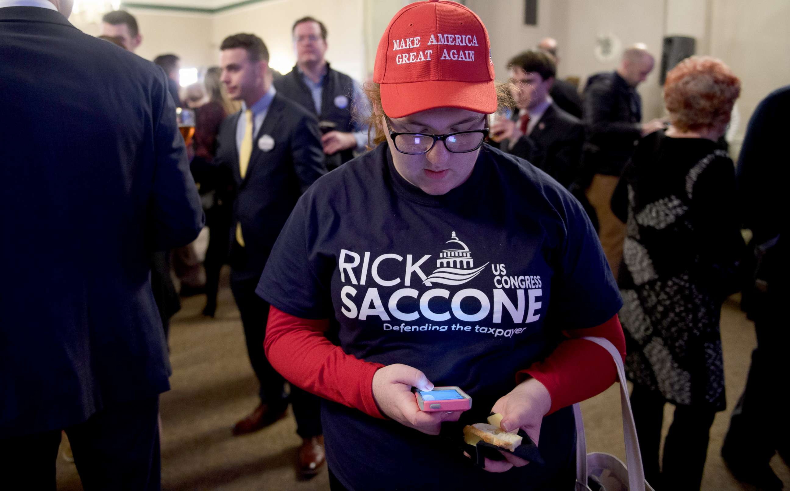 PHOTO: Campaign volunteer Chloe Chappell checks early election results at an Election Night event for GOP PA Congressional Candidate Rick Saccone as the polls close on March 13, 2018 in Elizabeth Township, Pennsylvania.