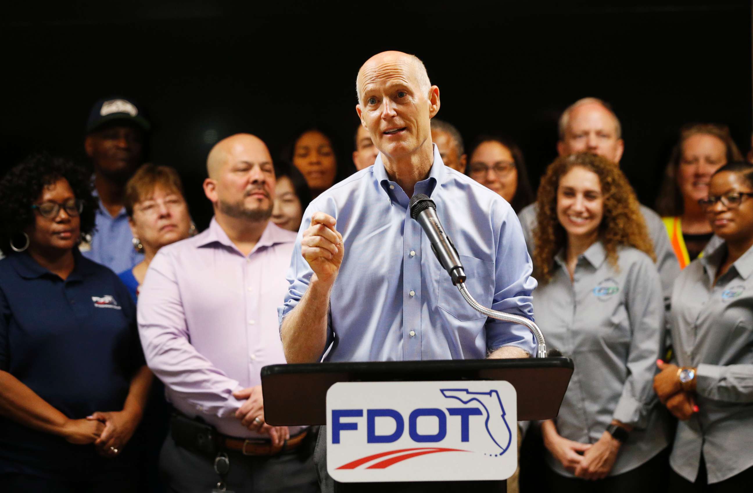 PHOTO: Florida Gov. Rick Scott, center, speaks during a news conference at the Florida Department of Transportation (FDOT) District Four Office, Aug. 22, 2018, in Fort Lauderdale, Fla. 