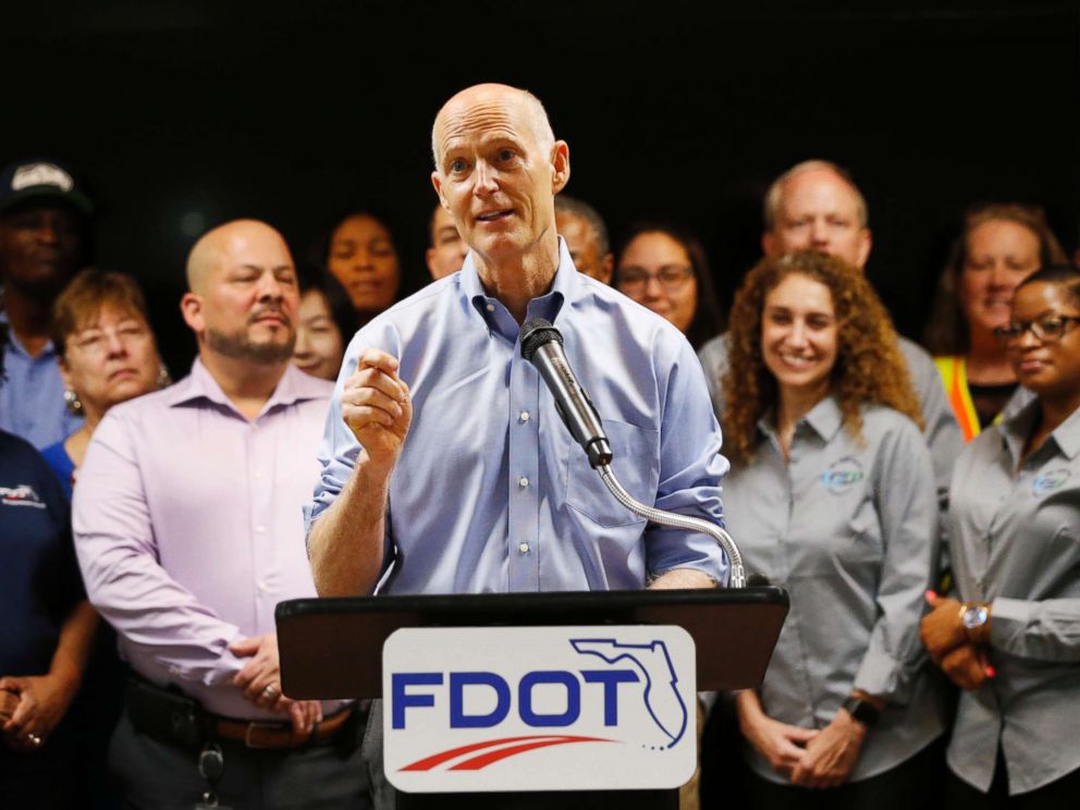 PHOTO: Florida Gov. Rick Scott, center, speaks during a news conference at the Florida Department of Transportation (FDOT) District Four Office, Aug. 22, 2018, in Fort Lauderdale, Fla.