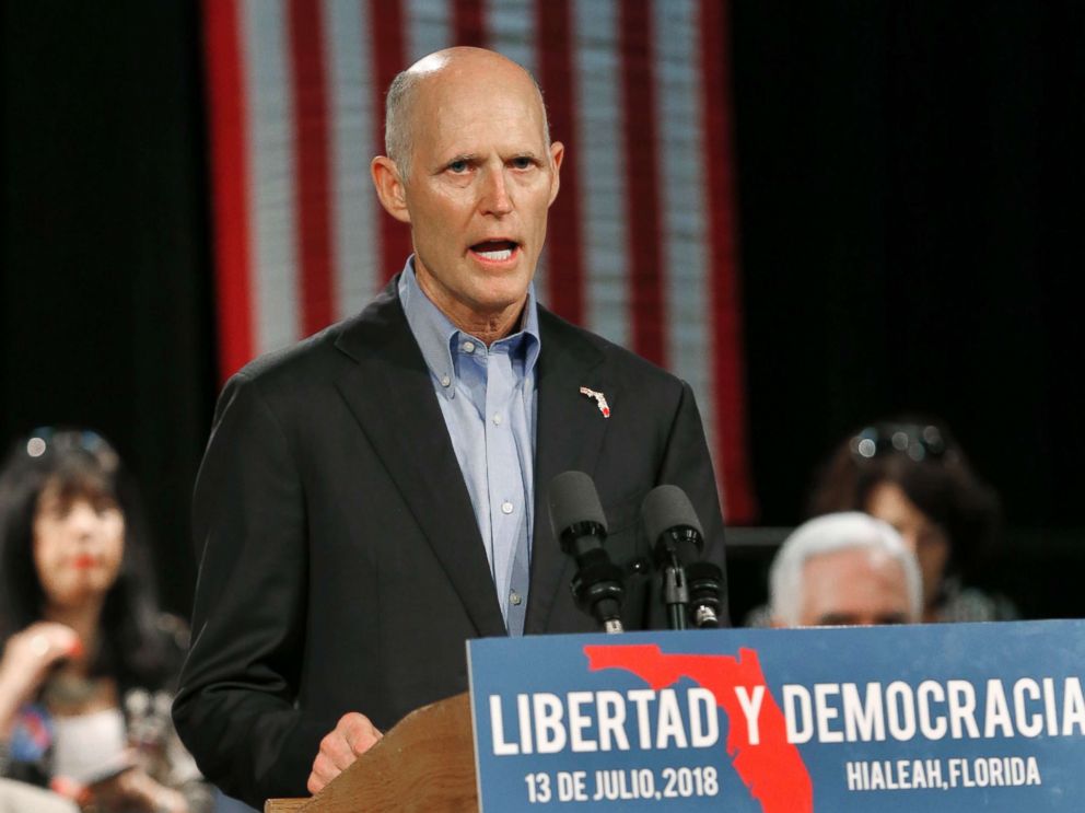 Florida Gov. Rick Scott, speaks to Cuban-American supporters at a campaign stop, in Hialeah, Fla., July 13.