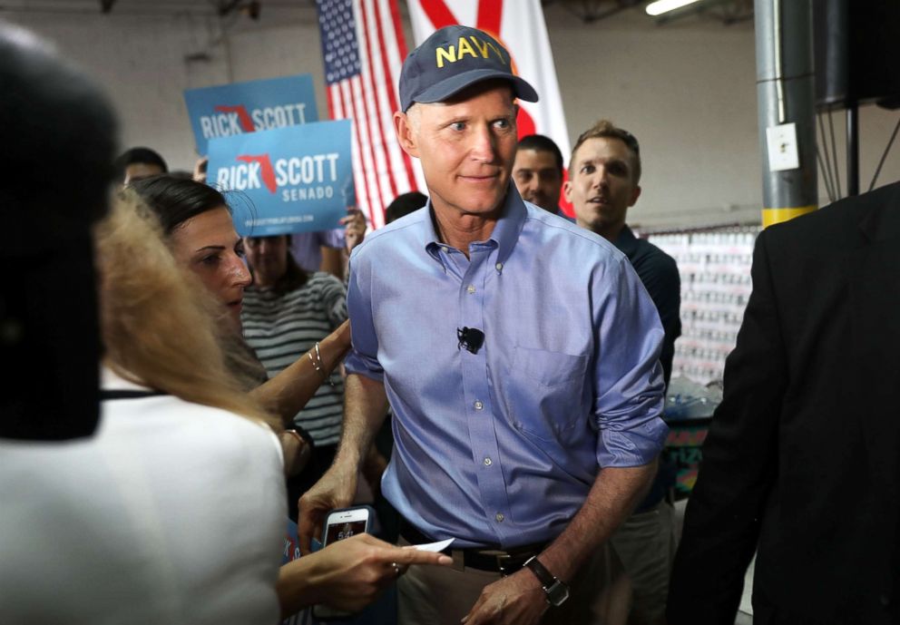 PHOTO: Fla. Governor Rick Scott greets people as he holds a Senate campaign rally at the Interstate Beverage Corp., April 10, 2018, in Hialeah, Fla.