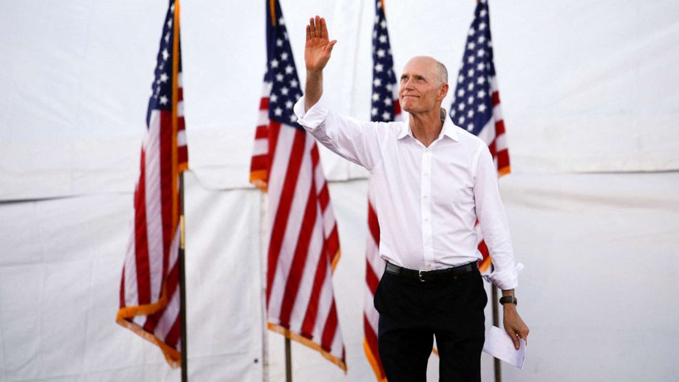 PHOTO: Senator Rick Scott, chairman of the National Republican Senatorial Committee, takes the stage during a rally with former President Donald Trump ahead of the midterm elections November 6, 2022 in Miami, Florida.