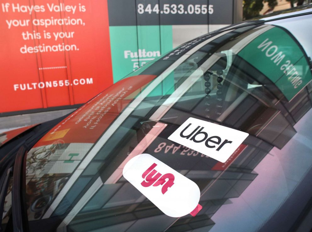 PHOTO: Uber and Lyft signage seen on a car parked on Fulton at Laguna streets on Jan. 29, 2020, in San Francisco.