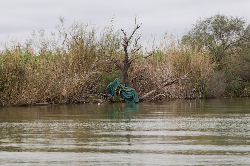 PHOTO: A deflated raft used by human traffickers is tangled in a tree along the banks of the Rio Grande on Jan. 16, 2019, in Mission, Texas.