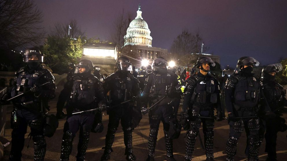 PHOTO: Police officers in riot gear line up as protesters gather on the U.S. Capitol Building, Jan. 6, 2021, in Washington, D.C.