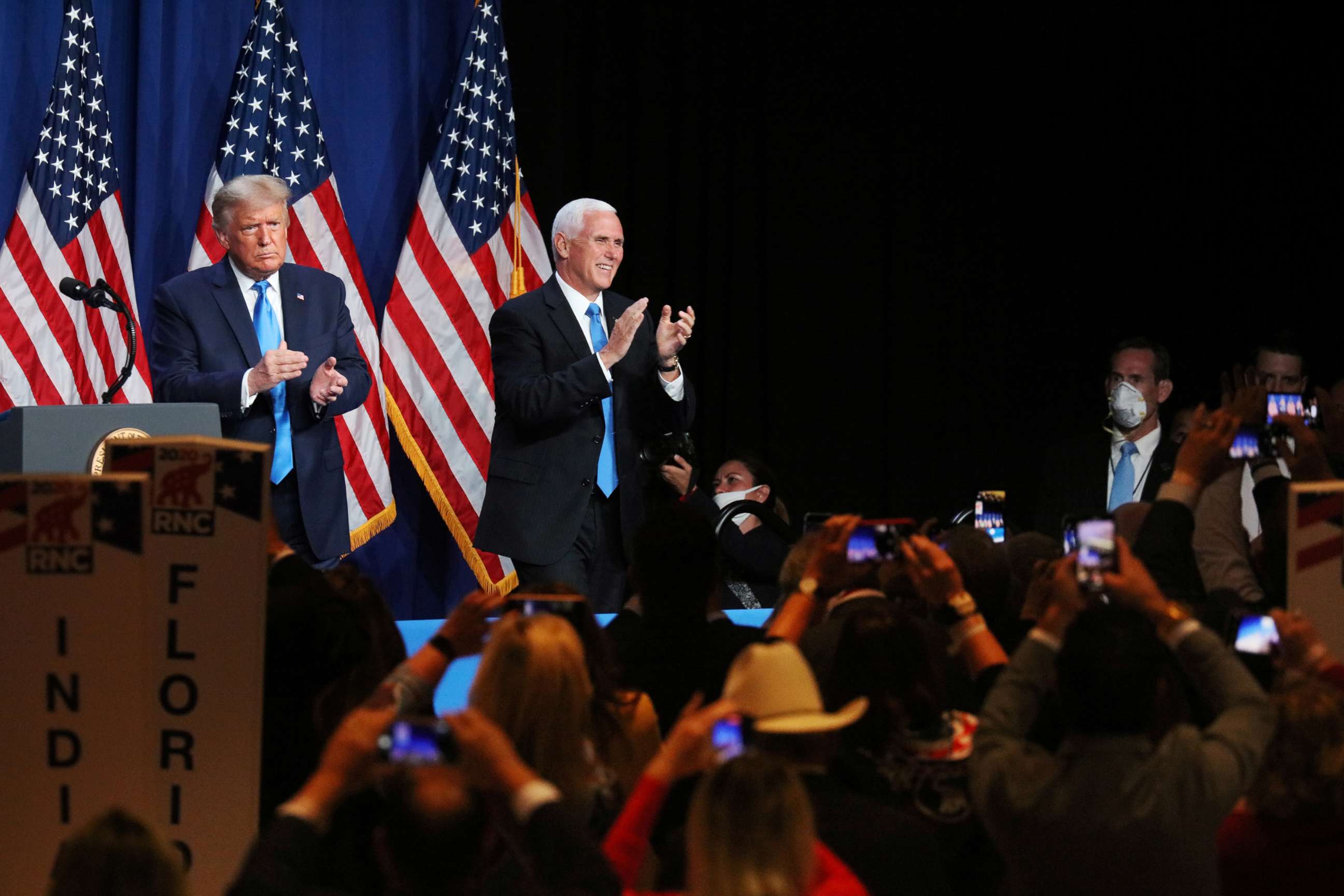 PHOTO: President Donald Trump and Vice President Pence applaud in the Charlotte Convention Center's Richardson Ballroom in Charlotte, N.C., Aug. 24, 2020.