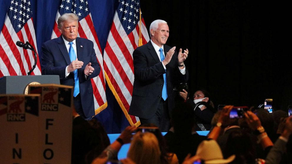 PHOTO: President Donald Trump and Vice President Pence applaud in the Charlotte Convention Center's Richardson Ballroom in Charlotte, N.C., Aug. 24, 2020.