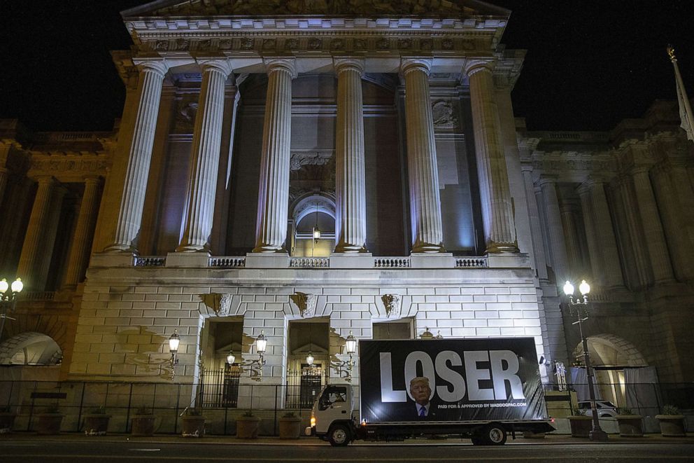 PHOTO: A truck displaying a message critical of President Donald Trump sits parked outside the Andrew Mellon Auditorium where speakers took park in opening night of the virtual Republican National Convention on Aug. 24, 2020, in Washington.
