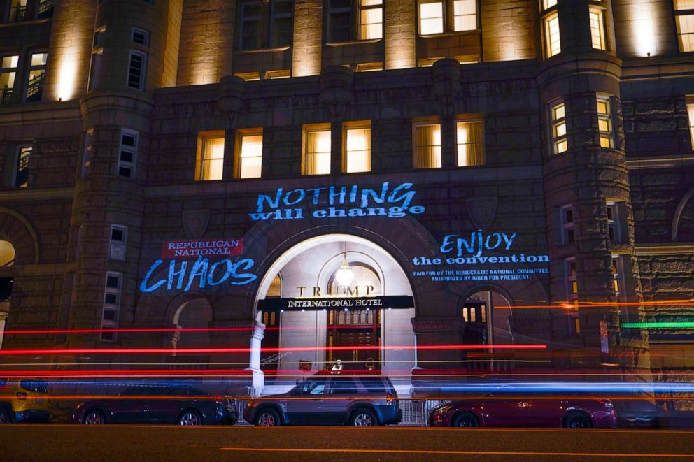 PHOTO: Projected messages onto the Trump International Hotel by multimedia artist Robin Bell, during the second night of the Republican National Convention in Washington, Aug. 25, 2020.