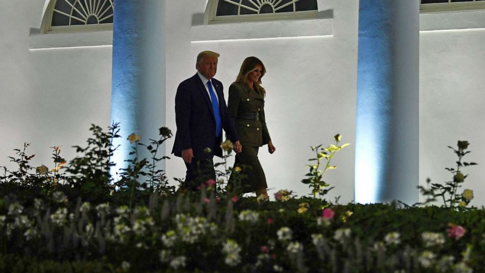 PHOTO: President Donald Trump and first lady Melania Trump walk by the Colonnade before she addresses the Republican Convention during its second day from the Rose Garden of the White House, Aug. 25, 2020, in Washington.