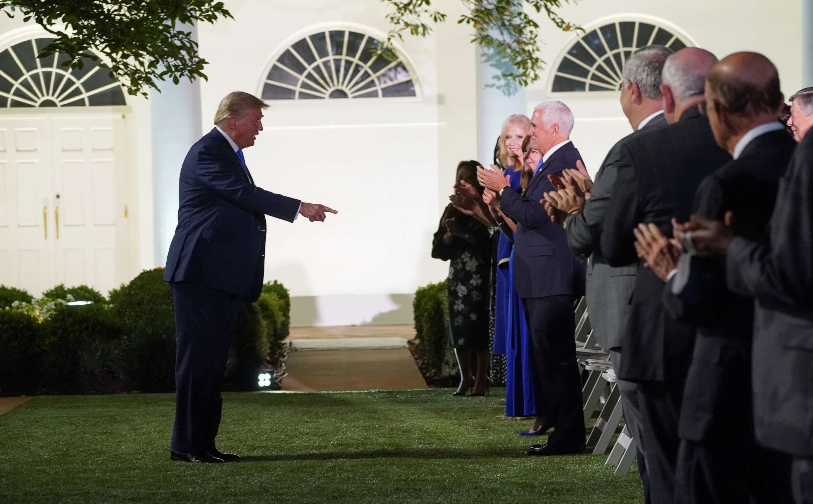 PHOTO: President Donald Trump reacts to applause as he arrives to listen to first lady Melania Trump deliver her live address to 2020 Republican National Convention from the Rose Garden of the White House in Washington, Aug. 25, 2020.