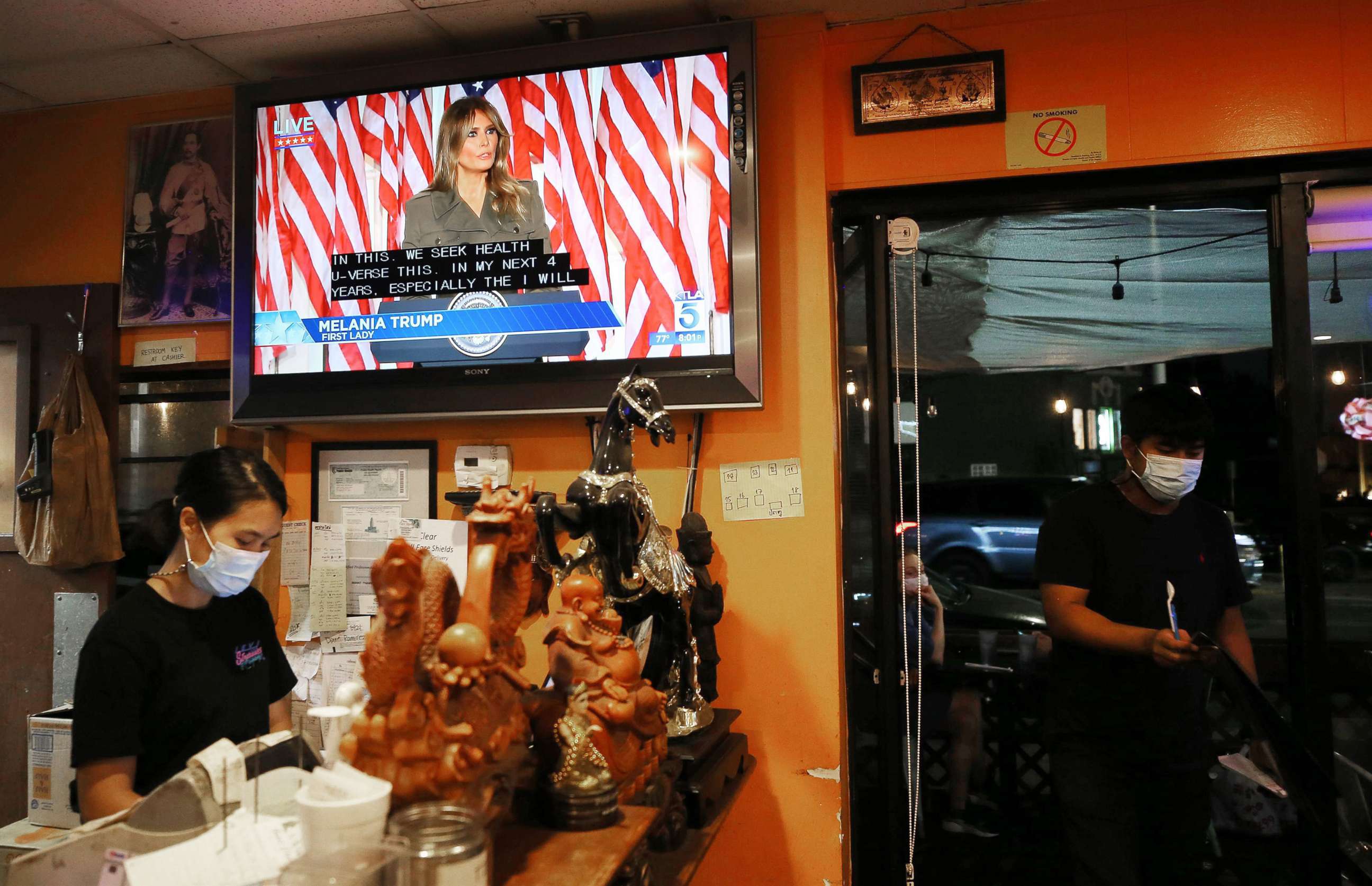 PHOTO: First lady Melania Trump is shown on a TV in a Thai restaurant as she speaks from the White house during the second night of the 2020 Republican National Convention, Aug. 25, 2020, in Los Angeles.