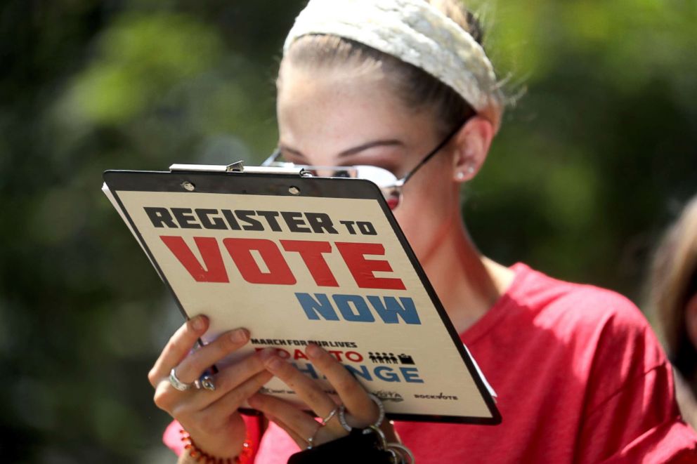 PHOTO: Chloe Weiland registers to vote during the Road to Change bus tour, July 28, 2018, in Tallahassee, Fla.