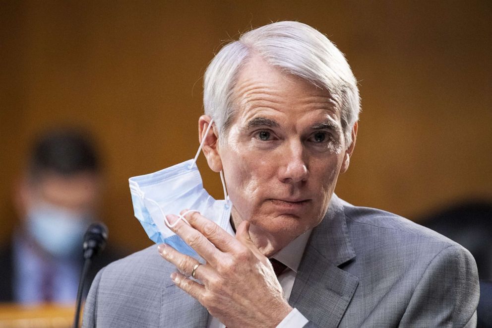 PHOTO: Sen. Rob Portman takes off a mask during a Senate Finance Committee hearing on COVID-19/Unemployment Insurance on Capitol Hill in Washington, June 9, 2020.