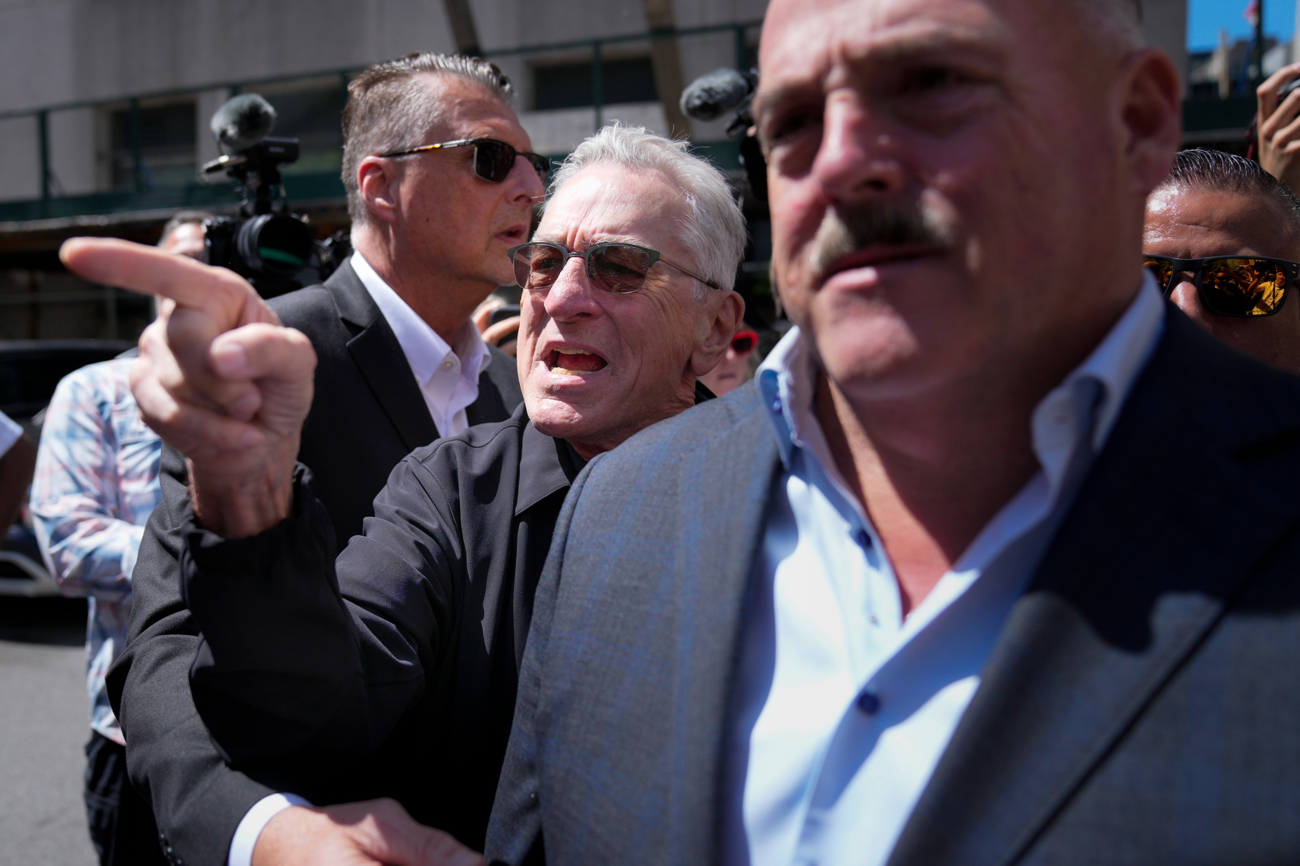 PHOTO: Robert De Niro argues with a Donald Trump supporter after speaking to reporters in support of President Joe Biden across the street from Trump's criminal trial in New York, May 28, 2024. 