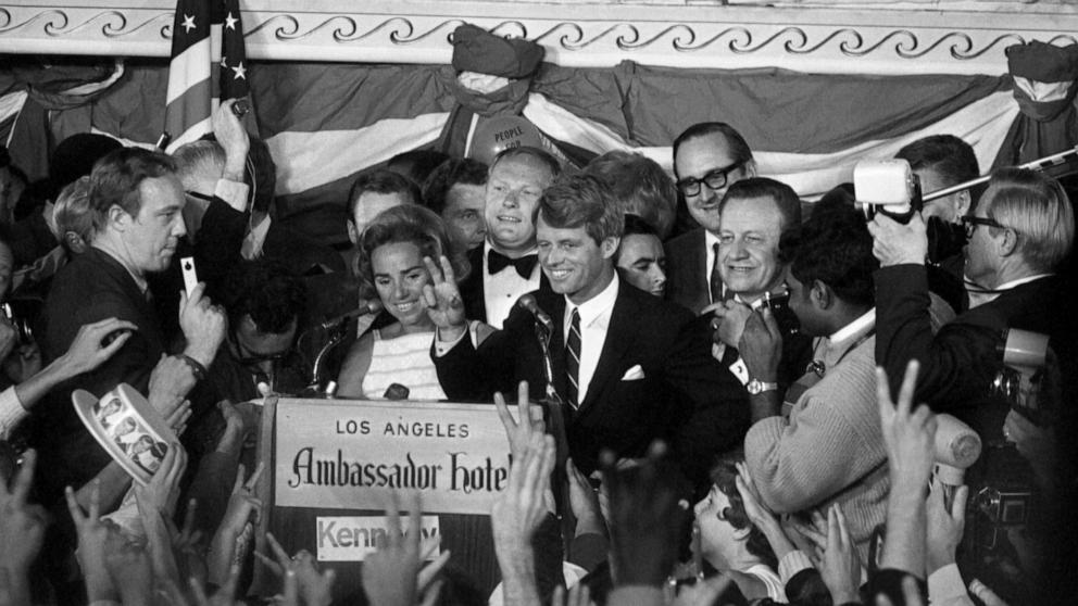 PHOTO: Sen. Robert Francis Kennedy, his wife Ethel standing behind him, gives victory sign to huge crowd at the Ambassador Hotel June 5, 1968 prior to making victory speech after winning the California primary.