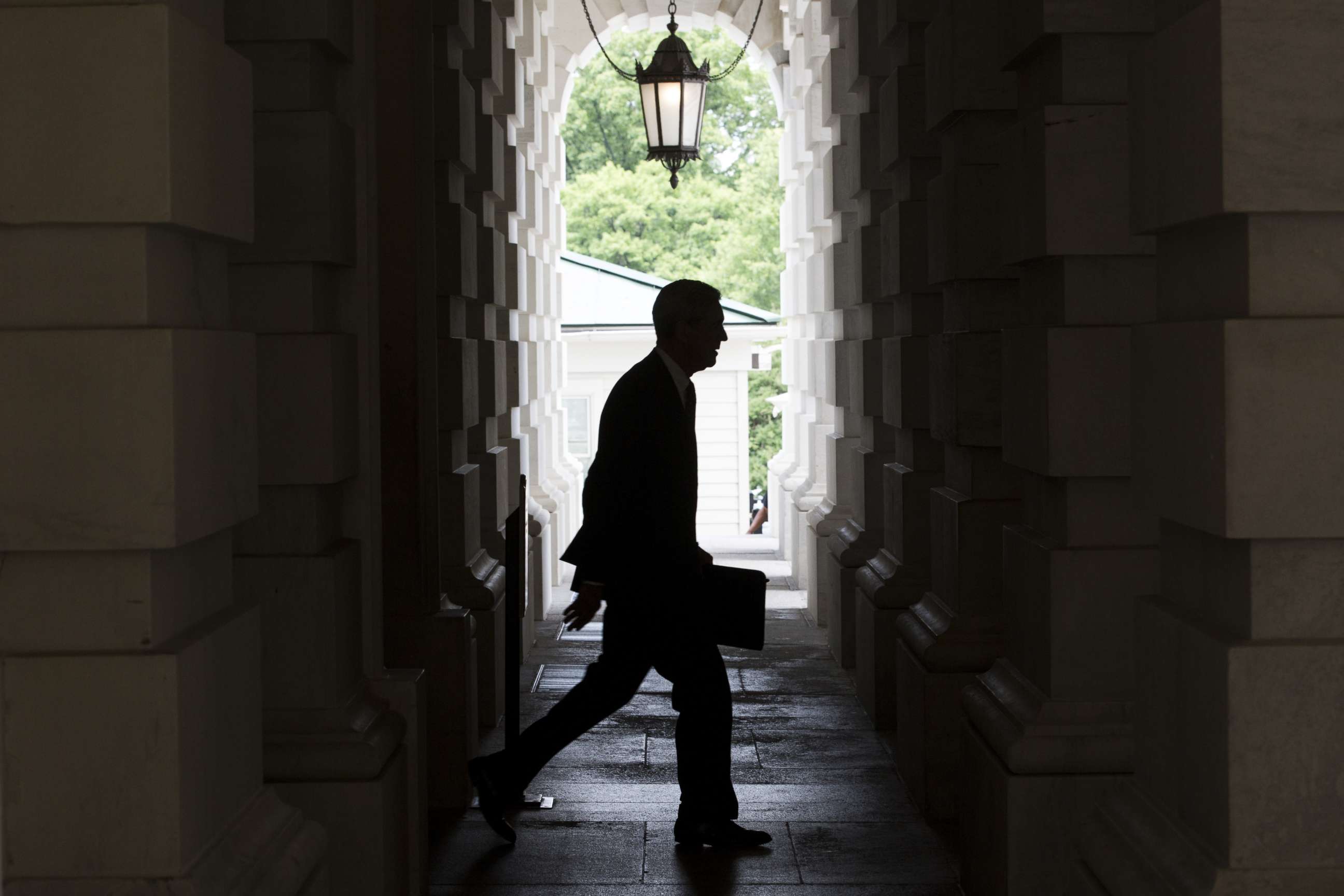 PHOTO: The silhouette of Robert Mueller, former director of the FBI and special counsel for the U.S. Department of Justice, is seen as he leaves the U.S. Capitol Building, June 20, 2017. 