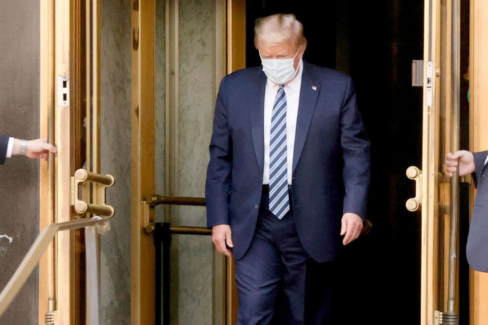 PHOTO: President Donald Trump walks out the front doors of Walter Reed National Military Medical Center to return to the White House, Oct. 5, 2020.